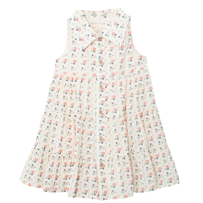 Floral tiered girls dress with collared neckline and button front on white background