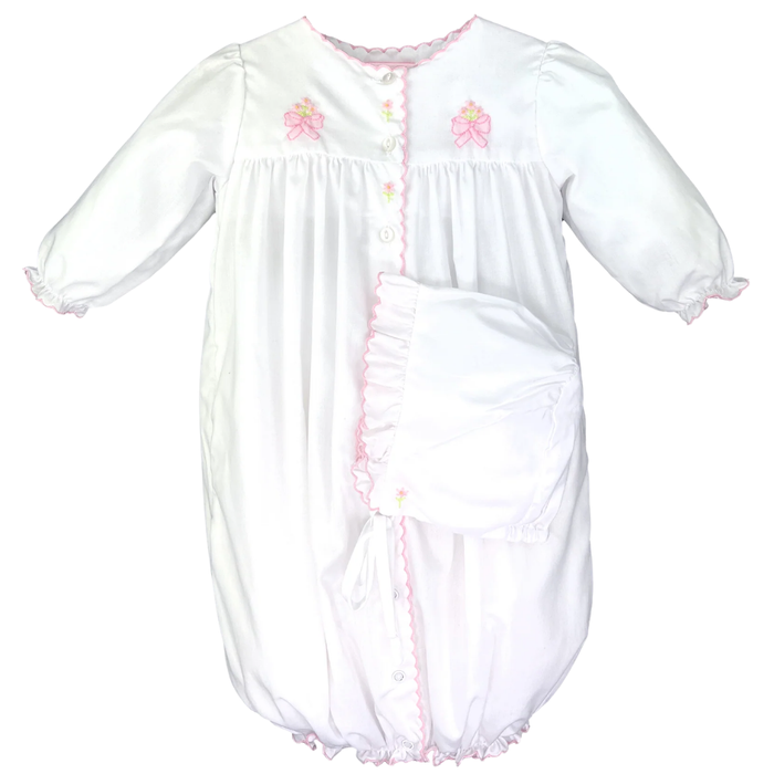 Baby girl white convertible gown with pink trim, embroidered bow details, and matching bonnet