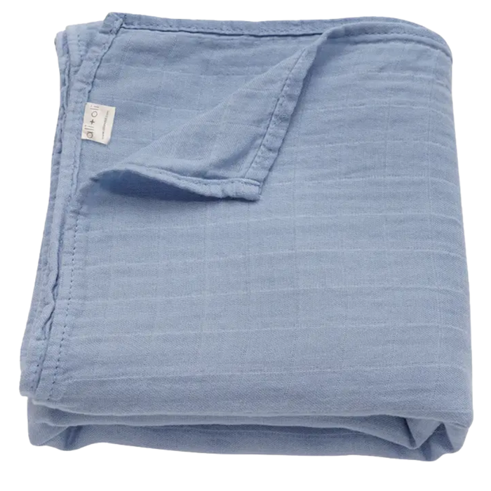 Solid dream blue bamboo muslin baby swaddle blanket folded to display its soft, breathable fabric.