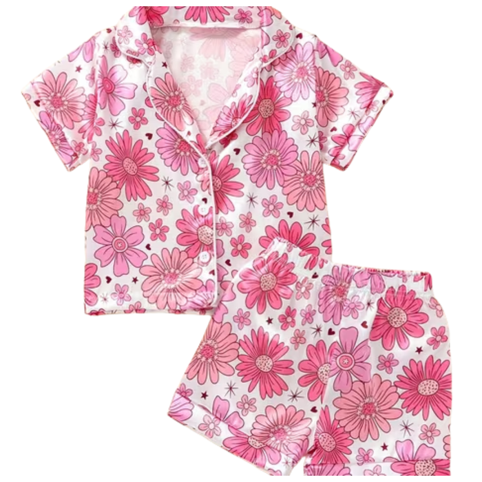 Pink groovy floral satin pajama set with short sleeve button-front top and matching elastic waist shorts.