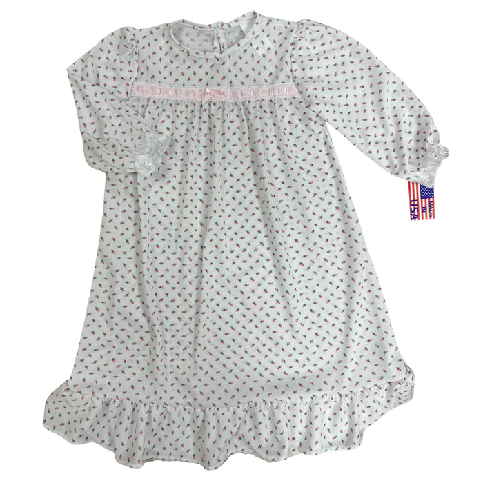 white long sleeve gown with a pink rose bud pattern.