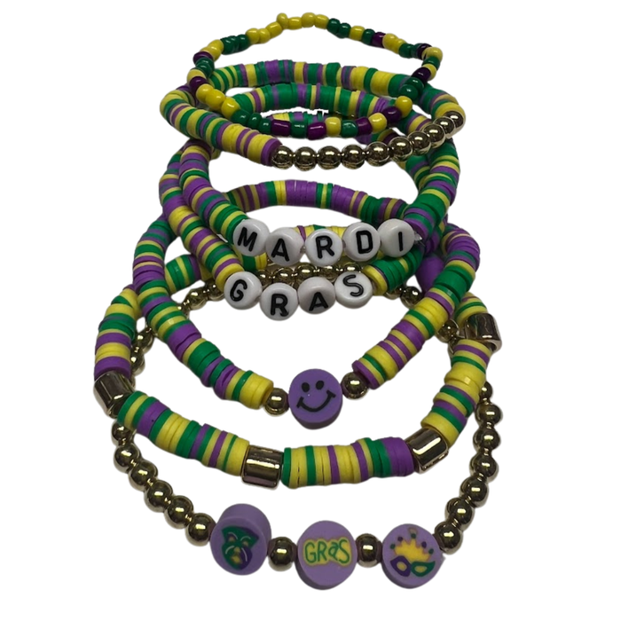 Set of seven Mardi Gras stretchy bracelets with purple, green, and gold clay beads, gold accents, and themed charms and letter beads.