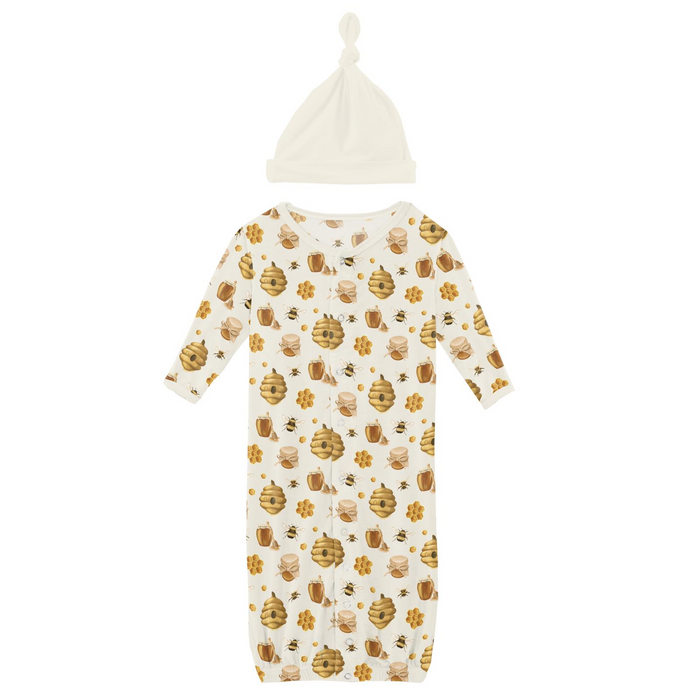 Newborn bamboo knotted gown with honey bee, hive, honeycomb, and honey jar print, paired with a matching knotted hat.