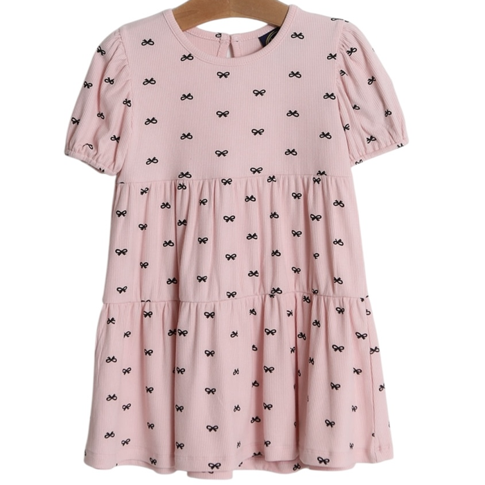 Pink girls tiered dress with black bow print, ribbed knit fabric, puff sleeves, and back button closure on hanger