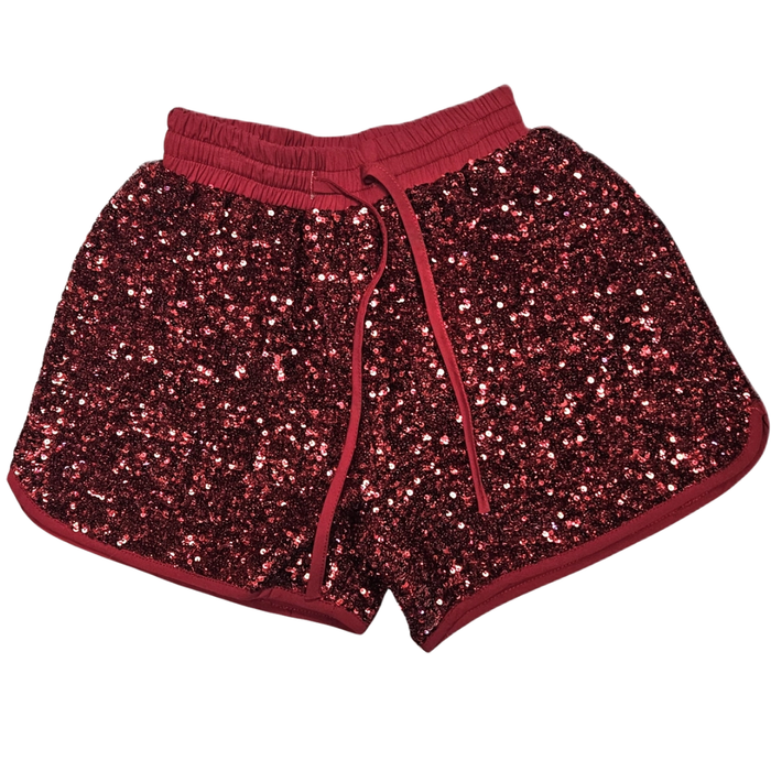 Red girls pull-on shorts covered in red sequins with elastic waistband and drawstring detail.