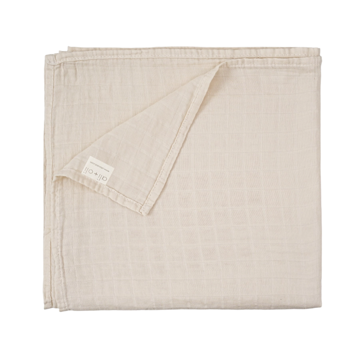 Solid misty sky blue bamboo muslin baby swaddle blanket folded to showcase its soft, breathable fabric.