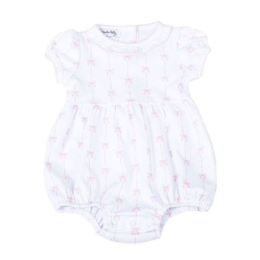 White baby bubble romper with pink bow print, short sleeves, gathered legs, and snap closure displayed on a white background