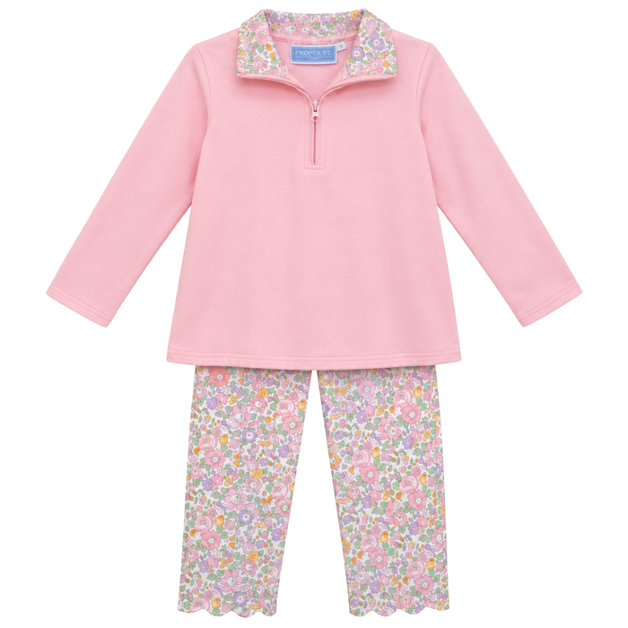 Girls two-piece outfit with pink quarter zip pullover and pastel floral leggings, featuring soft fabric and a comfortable fit.