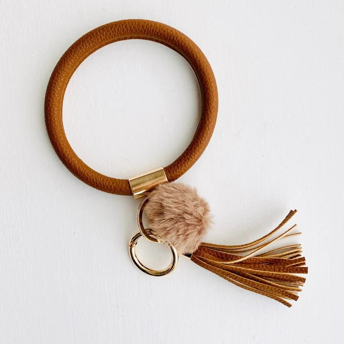 solid brown with a brown pom pom and a brown fringe