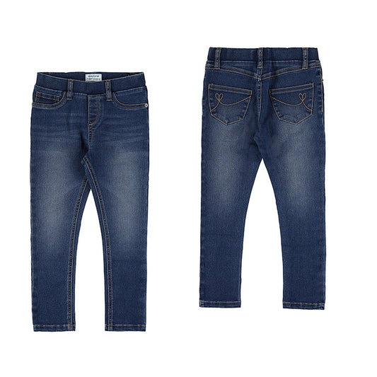 Girls’ medium wash jeans with front and back pockets, straight legs, and a soft, worn-in denim look.