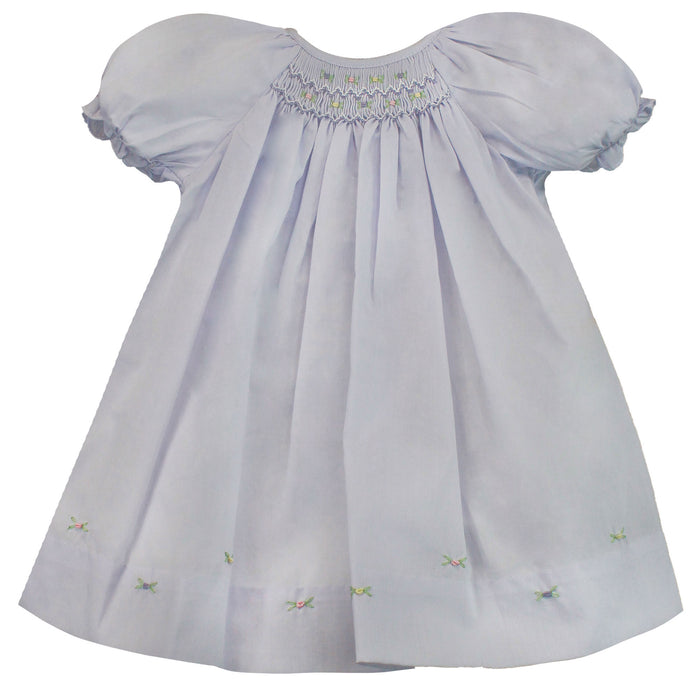 Purple dress smocked with roses on the hemline.