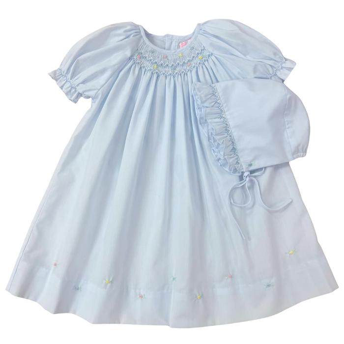 Light blue smocked baby dress with ruffled sleeves on a white background matching bonnet on preemie and newborn only