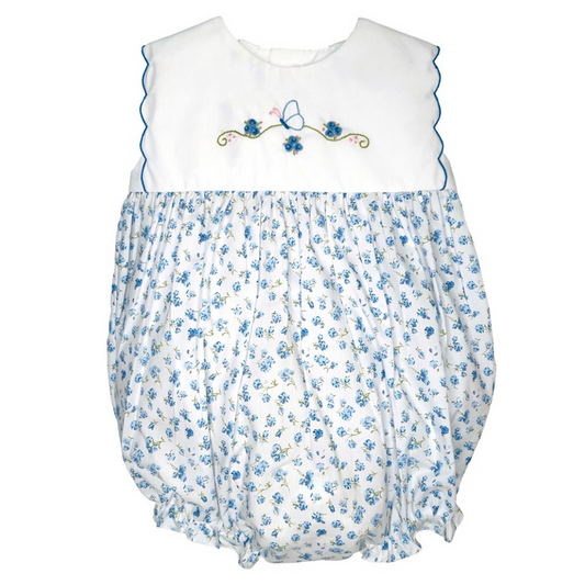 Baby romper with floral pattern and embroidered  butterfly details on a white background