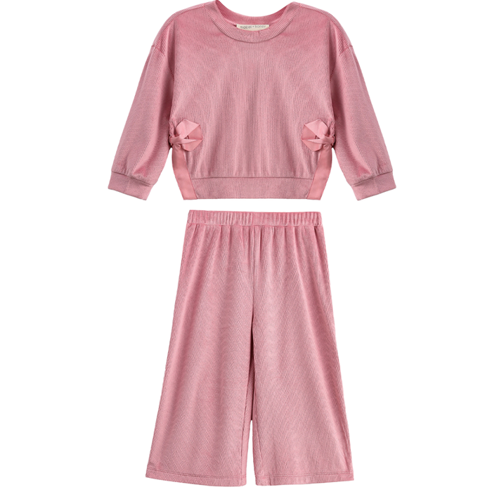Girls blush pink ribbed long sleeve top with bow accents and matching wide leg pants set on a white background.