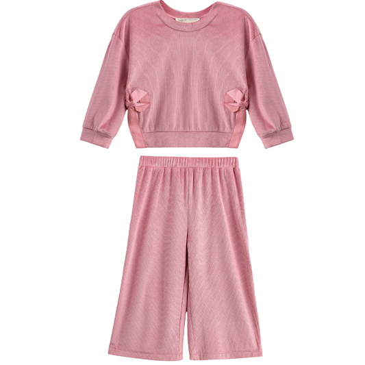 Girls blush pink ribbed long sleeve top with bow accents and matching wide leg pants set on a white background.