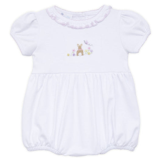 White baby bubble romper with puff sleeves, ruffled neckline, and embroidered bunny with flowers displayed on a white background