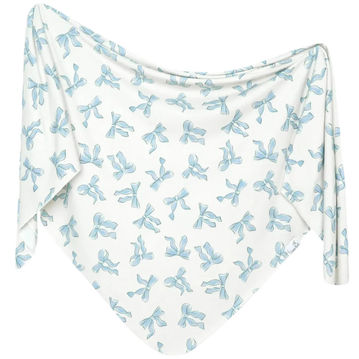 White fabric with blue bow pattern on a white background