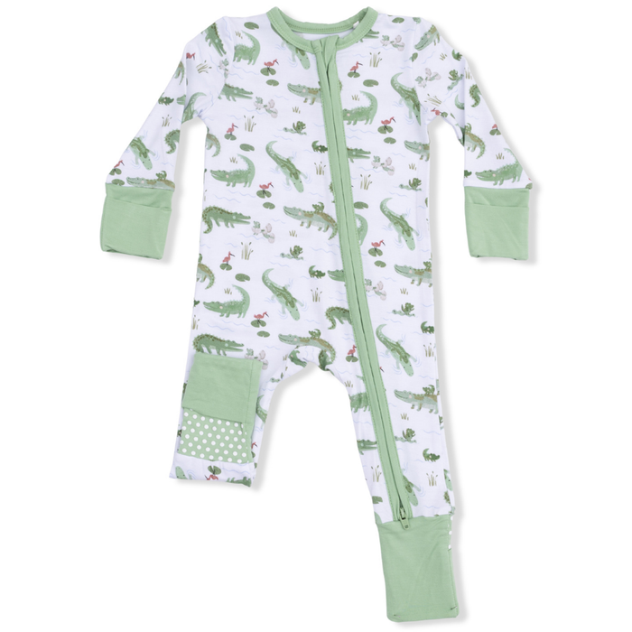 baby convertible romper with an alligator pattern, white with green trim