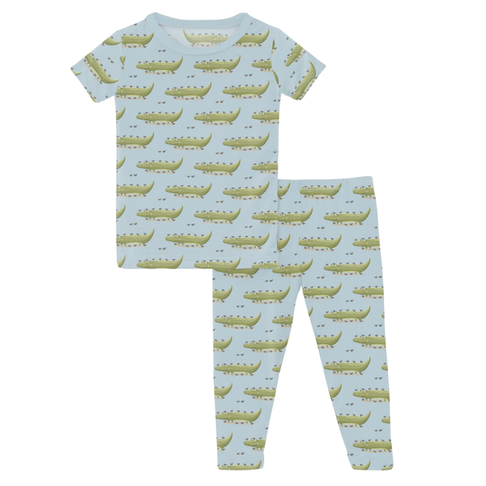 Blue boys pajama set with green crocodile print top and matching pants.