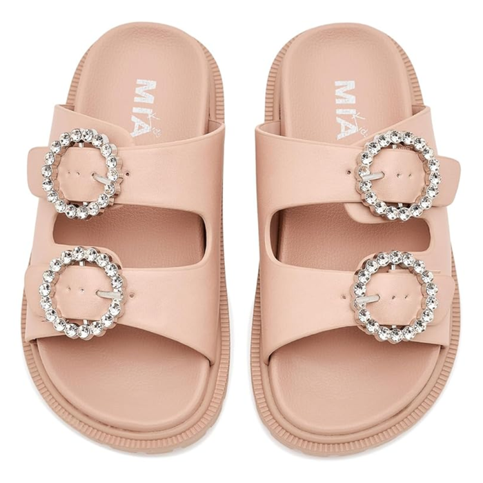 Blush pink girls slide sandal with oversized crystal buckle and textured lug sole.