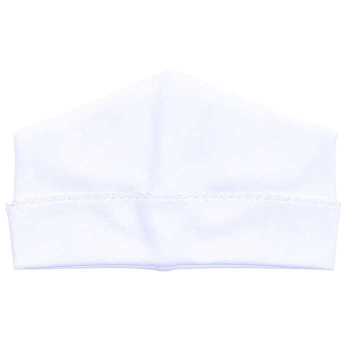 A white knit cap or headband with a folded cuff and short fringe trim, shown against a plain white background.