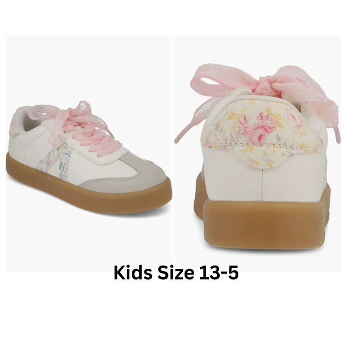 Floral-patterned children's sneakers with pink laces on a white background