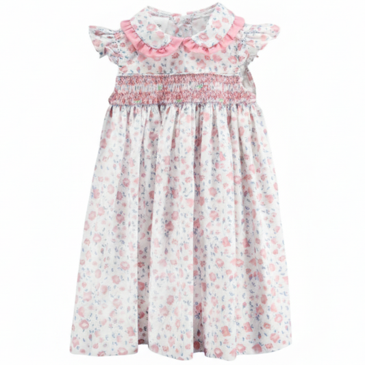 Girls Bunny Tales smocked dress with pink hand-smocked neckline, flutter sleeves, and pastel bunny print on white fabric