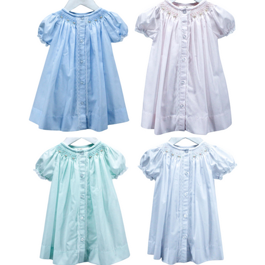 traditional style day dress for girl in white, pink, blue or mint.  Lace touches at the button placket and sleeve with bullion roses smocked at the neckline