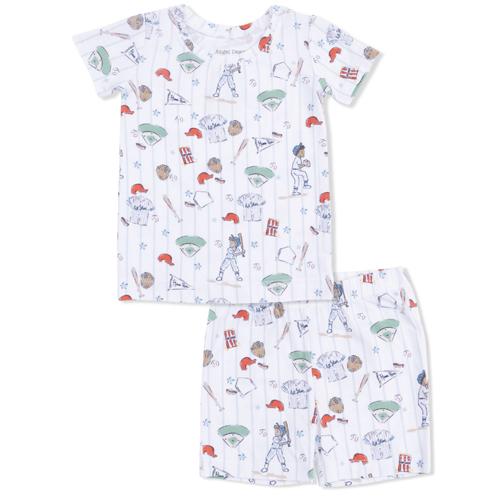 Children's pajama set with sports-themed pattern on a white background