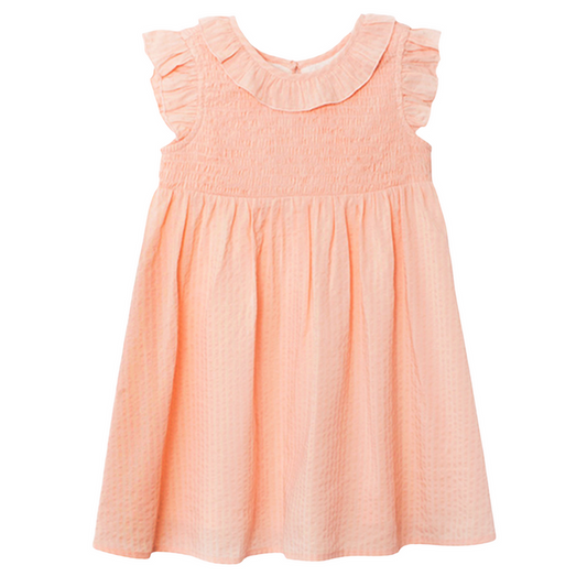 Peach smocked girls dress with ruffle collar and flutter sleeves on white background