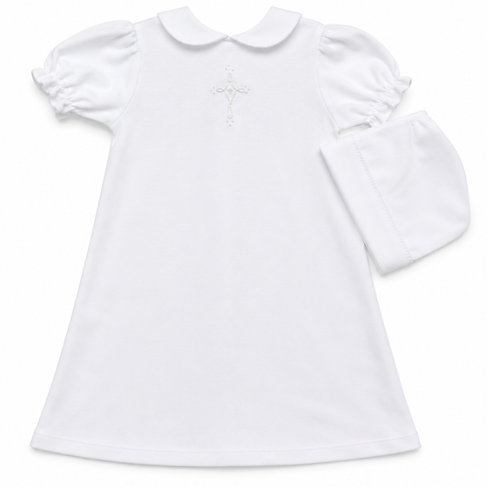 white knit daygown with hand embroidered cross on the front and a rounded collar. has a matching bonnet.