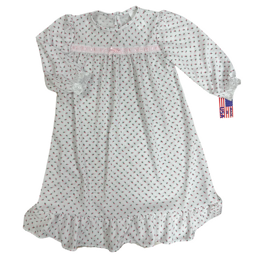 white long sleeve gown with a pink rose bud pattern.