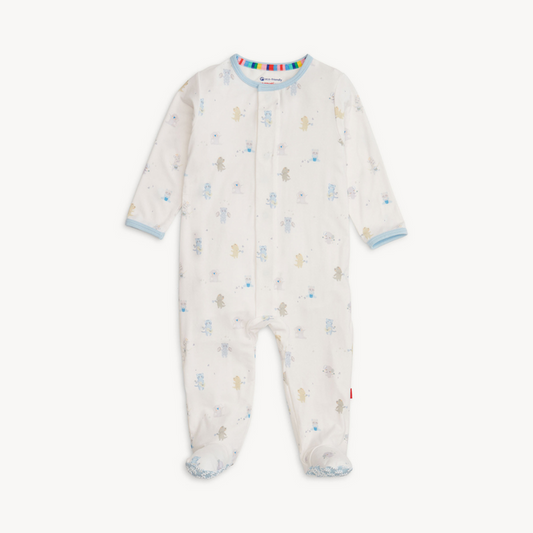 Baby wearing a soft TENCEL™ modal footie sleeper with magnetic closures and fold-over mittens for cozy, all-day comfort.