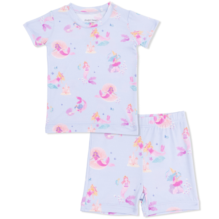 Children's pajama set with mermaid pattern on a light blue background