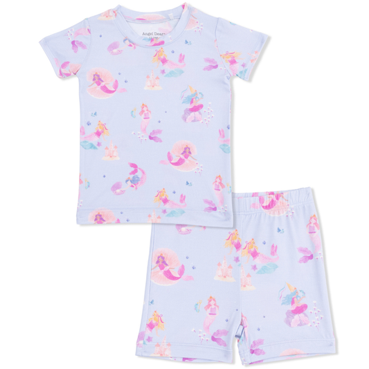 Children's pajama set with mermaid pattern on a light blue background