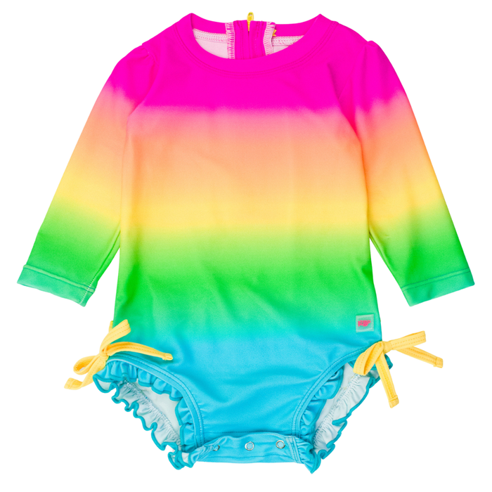 Long-sleeve neon ombré baby rashguard swimsuit in pink, yellow, green, and aqua with yellow bow ties and ruffle trim.