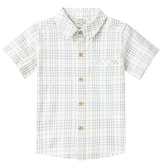 Boys cream short sleeve button down shirt with light blue plaid pattern and chest pocket on white background.