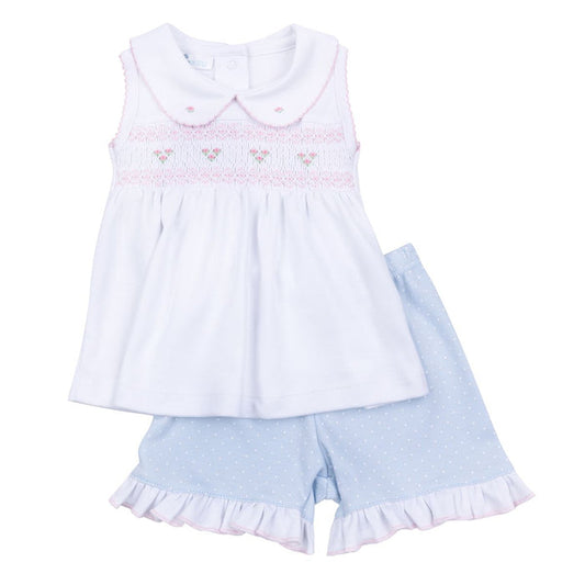 Baby girl blue smocked short set with white sleeveless smocked top, Peter Pan collar, and blue polka dot ruffle shorts
