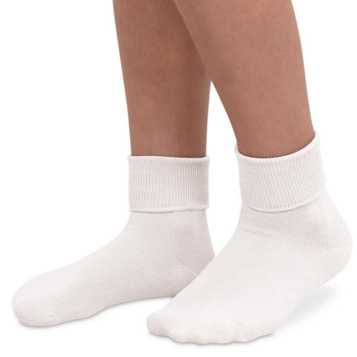 Classic cotton turn cuff socks with smooth toe construction, shown worn as a crew and folded cuff style in solid colors.