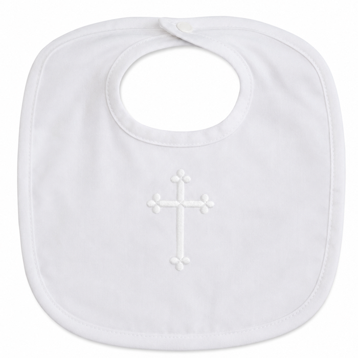 White baby bib with an embroidered cross on a white background