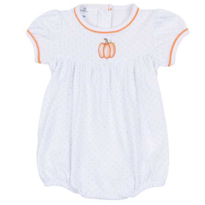 Baby white polka dot bubble romper with pumpkin embroidery and orange trim on a white background.