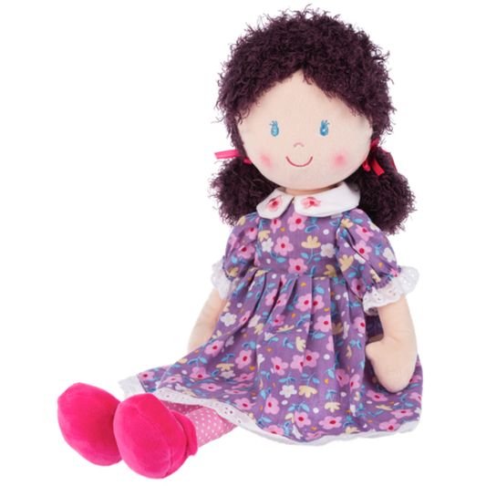 Soft plush rag doll wearing a purple floral dress with white collar, curly yarn hair, embroidered face, and bright pink shoes.