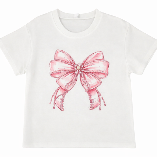 White girls short sleeve tee with large pink bow graphic and rhinestone detailing.