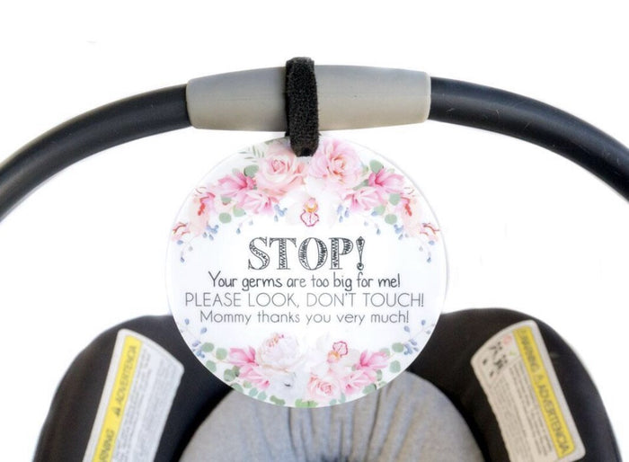 "stop. your germs are too big for me. please look, dont touch. mommy thanks you very much." floral pattern.