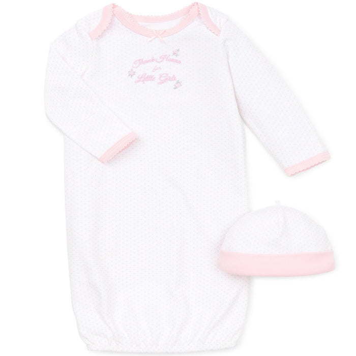 white gown with "thank heaven for little girls" stitched on the front. gown has little pink polka dots all over and has a matching hat.