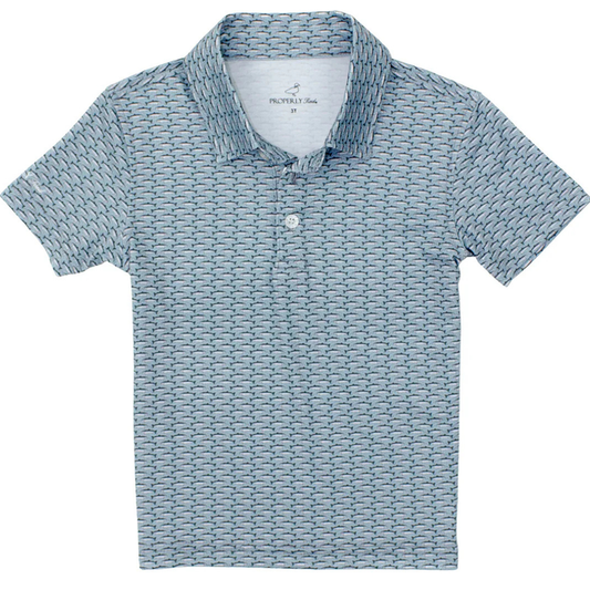 Boys blue short sleeve polo shirt with small repeating trout print and two-button collar.
