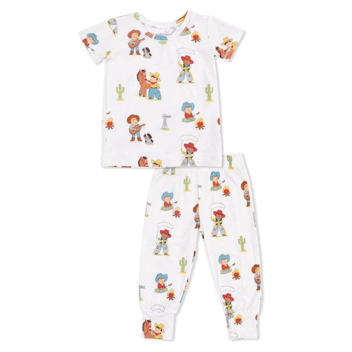 Children's pajama set with  a vintage cowboy print on a white background