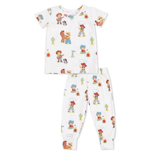 Children's pajama set with  a vintage cowboy print on a white background